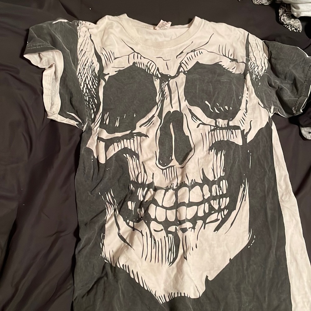 White and black t-shirt with a skull on it size medium in woman’s